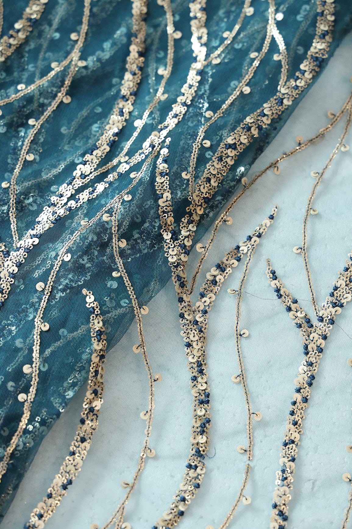 Gold And Silver Sequins With Blue Thread Wavy Embroidery Work On Rama Blue Soft Net Fabric - doeraa